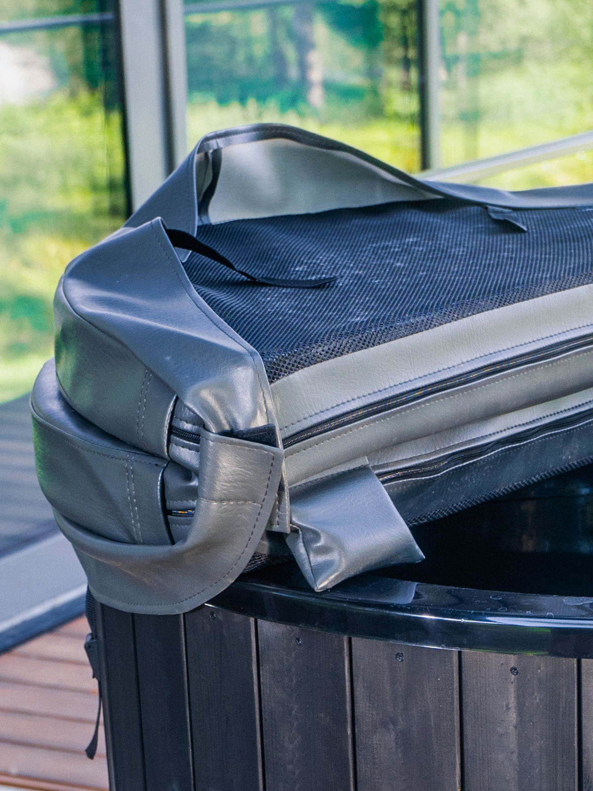 Hot tub cover on a hot tub with a blurred outdoor background