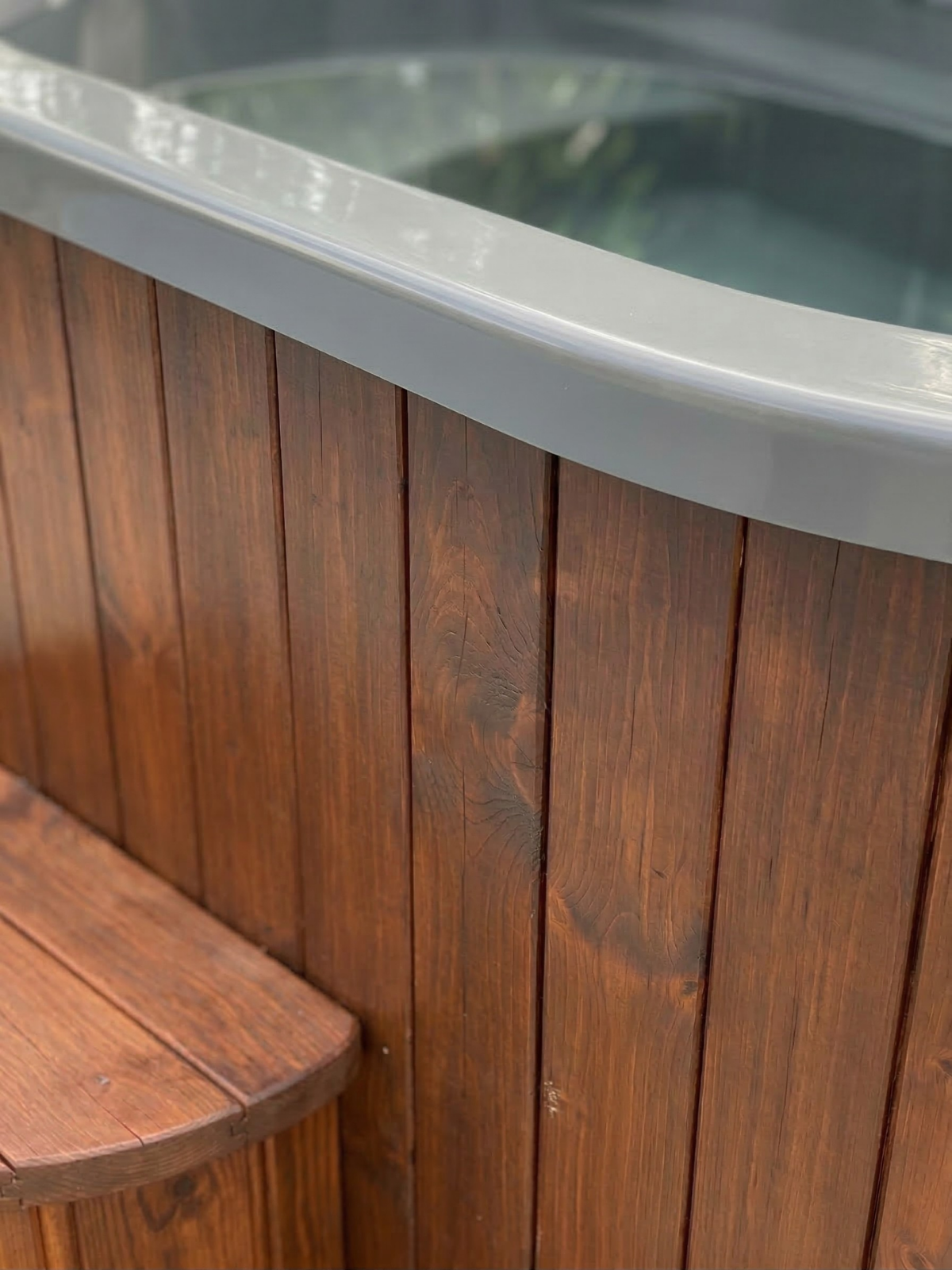 Hot tub with wooden exterior and metal interior