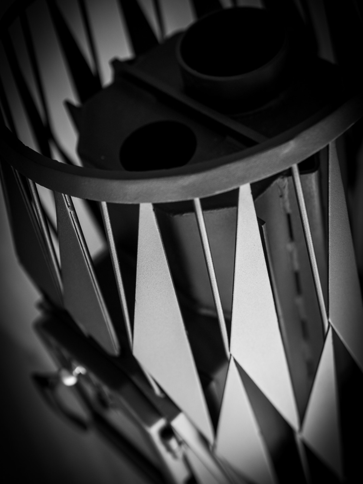 Close-up of a metallic gear with geometric design