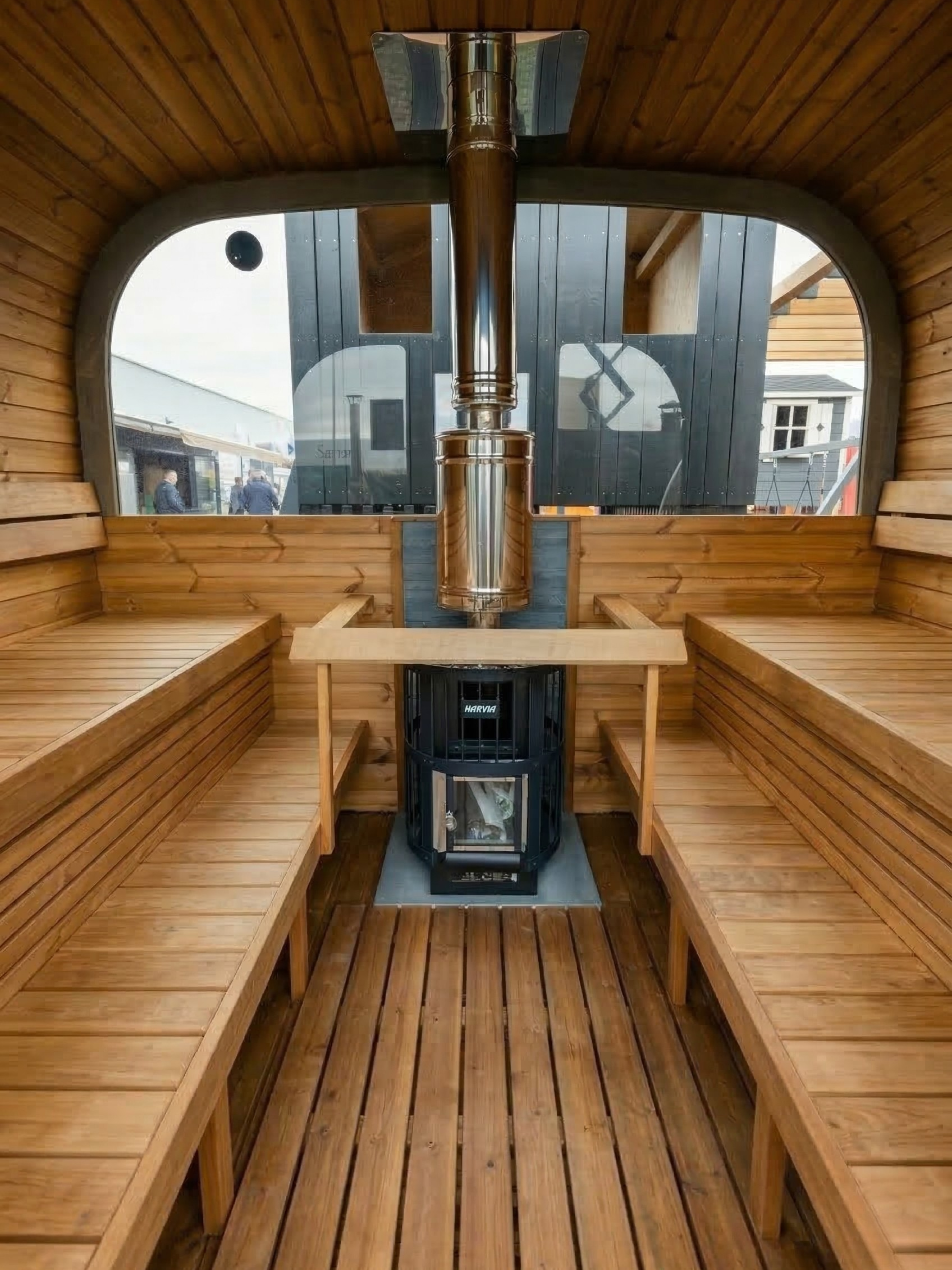 Wooden sauna interior with a stove and benches