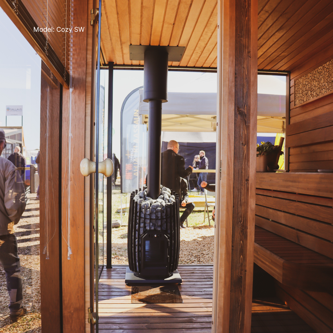 Wooden cabin interior with a view of people outside on a sunny day