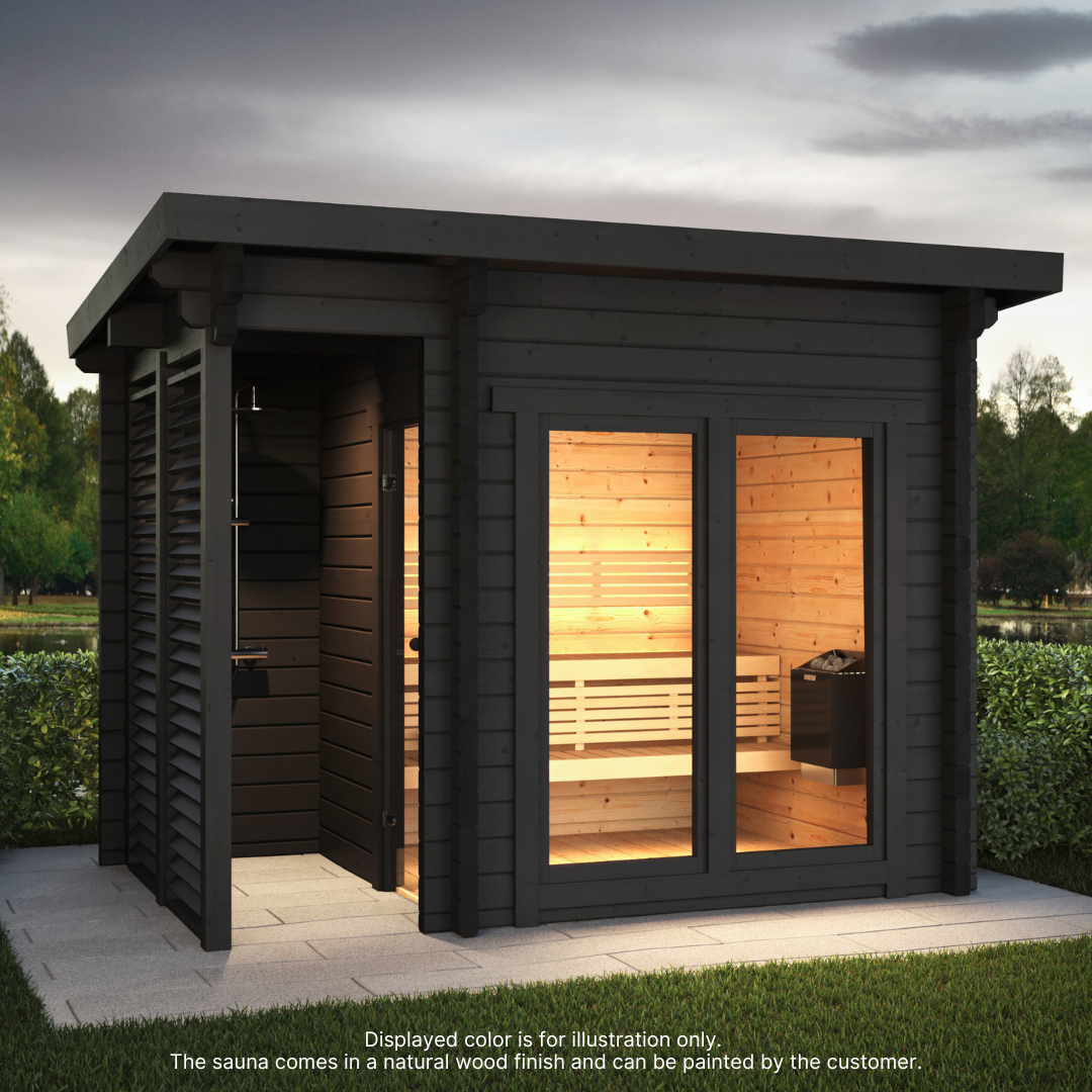 A cabin-style outdoor sauna with a dark roof and a light wood finish, featuring a shower area and bench seating, displayed in a natural wooded setting.
