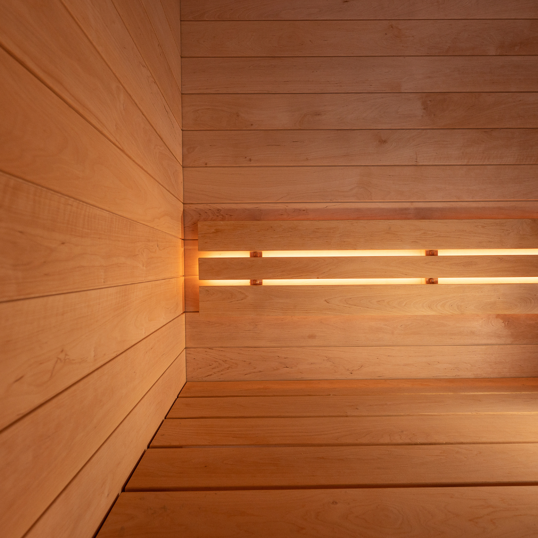 Wooden sauna interior with embedded lights