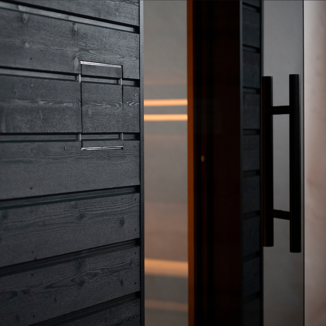 Close-up of a modern door with metallic handle and textured surface