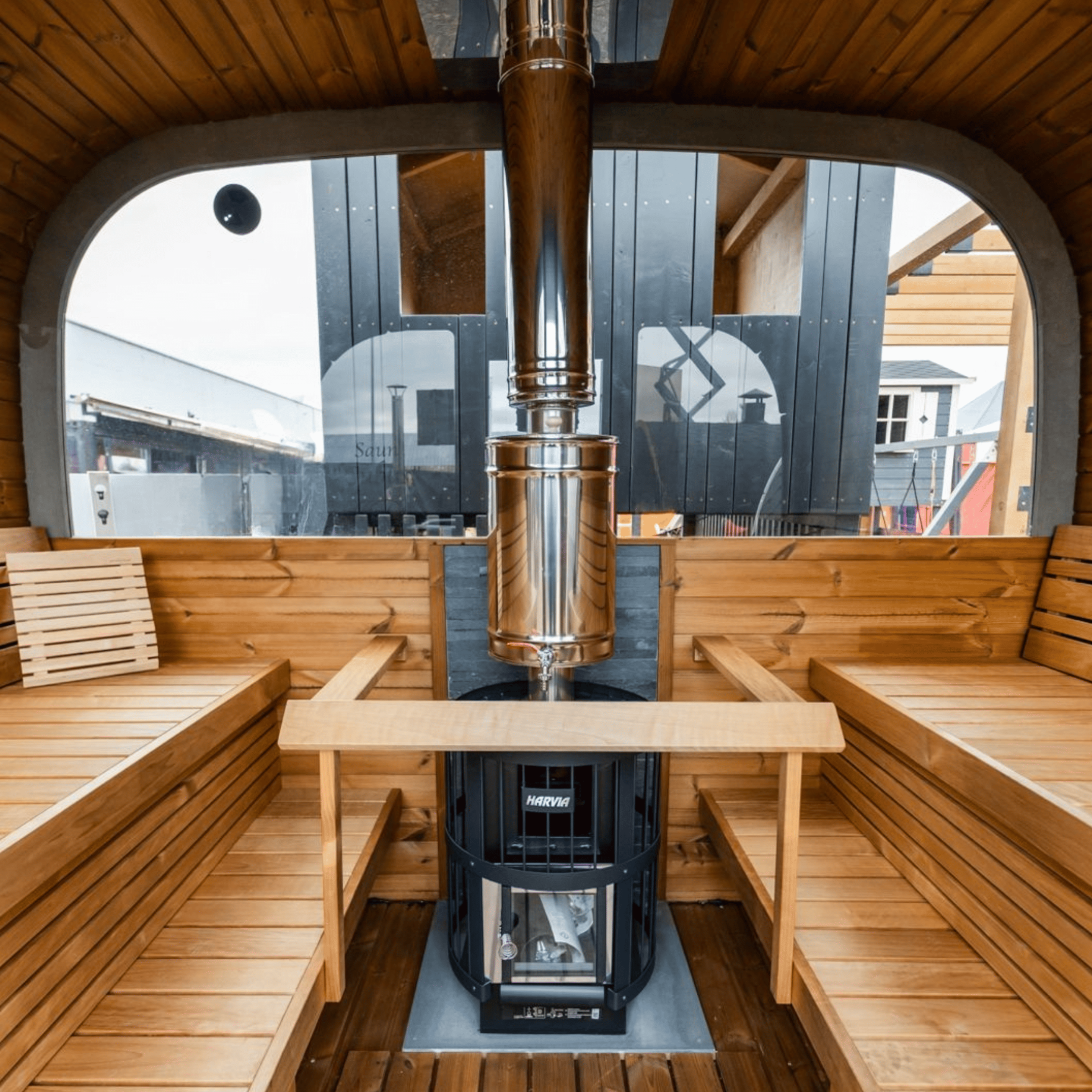 Wooden sauna interior with a stove and benches