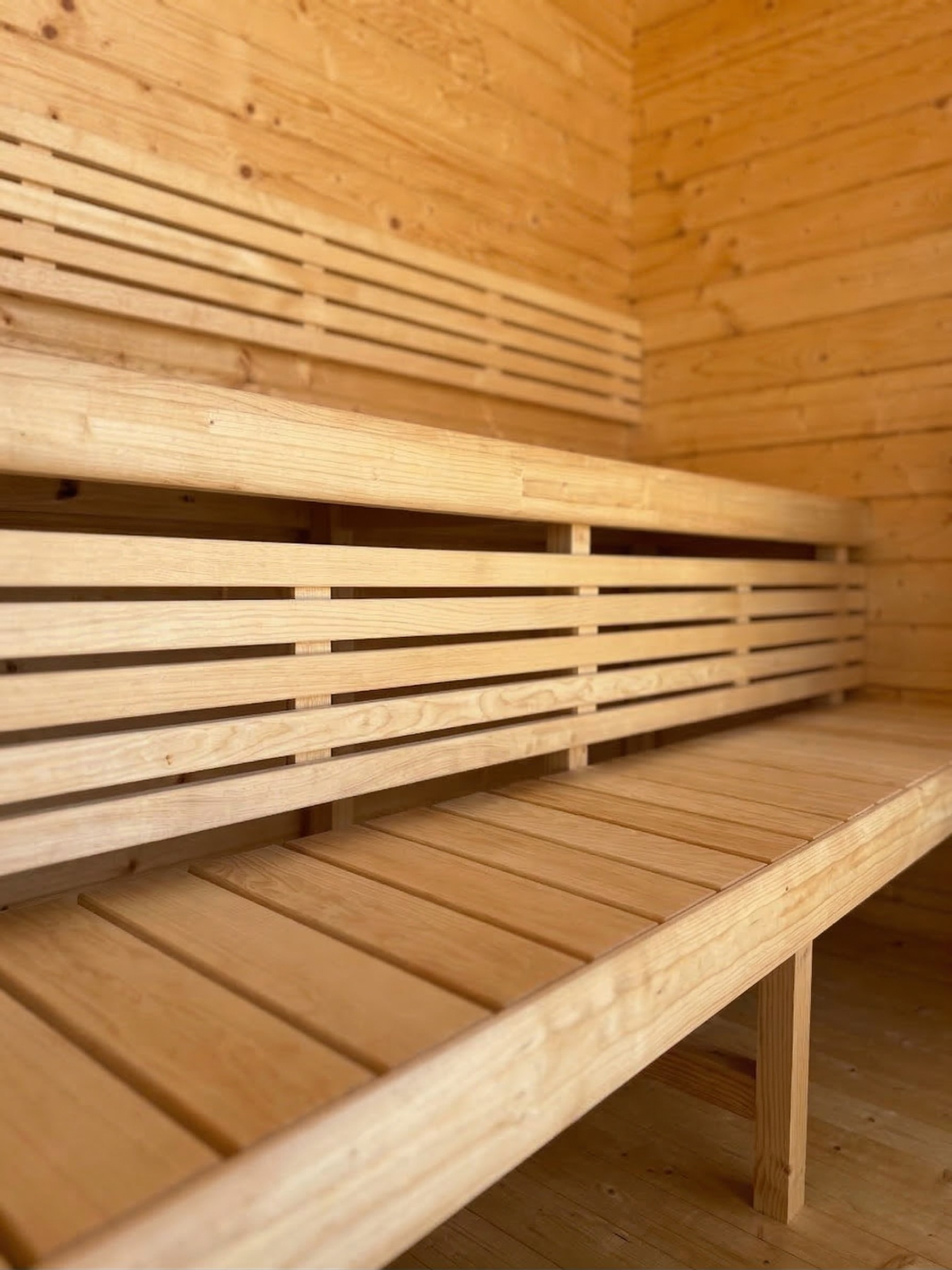 Wooden bench inside a wooden sauna