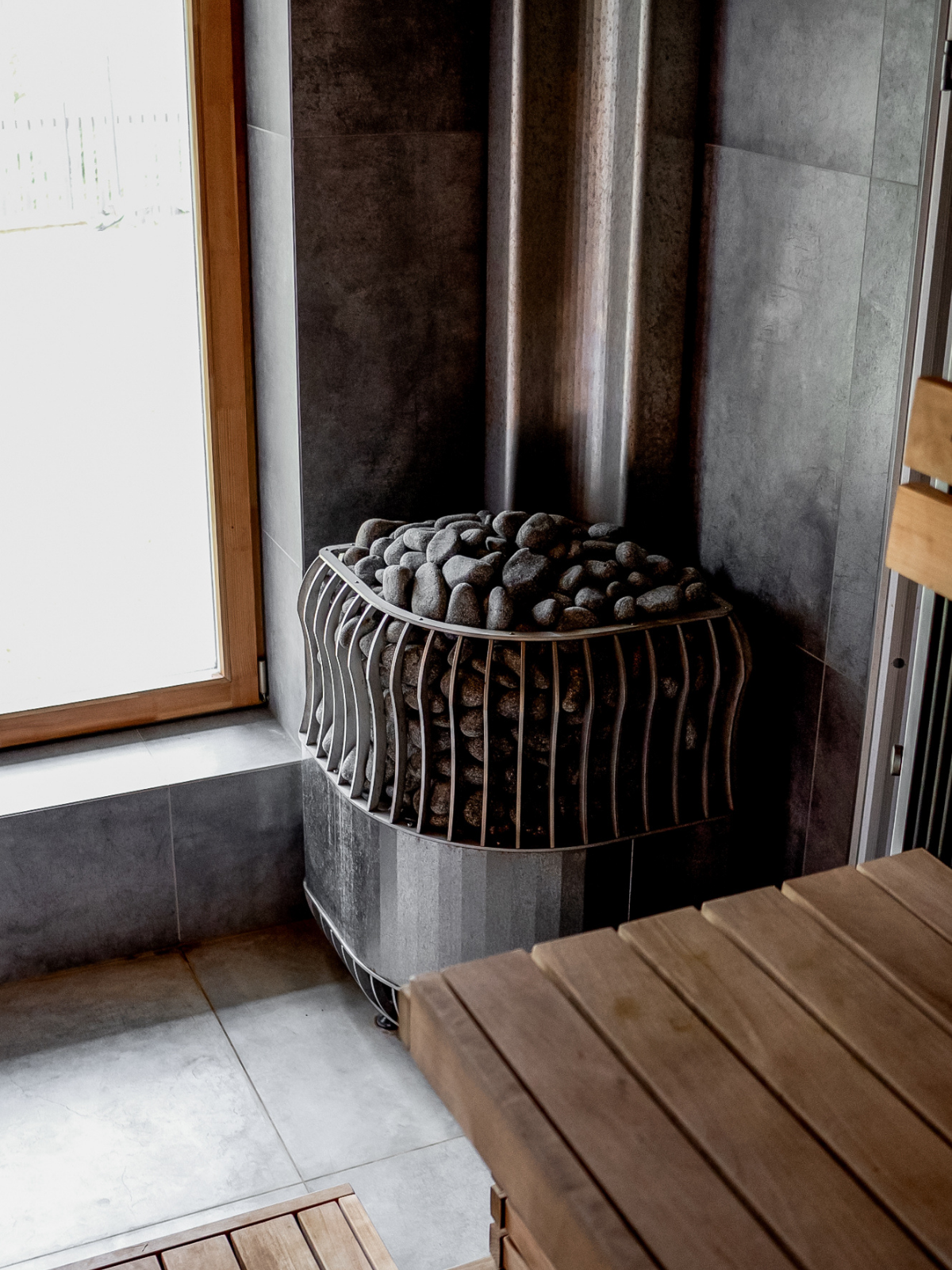 Modern radiator against a wall with a wooden table in the foreground