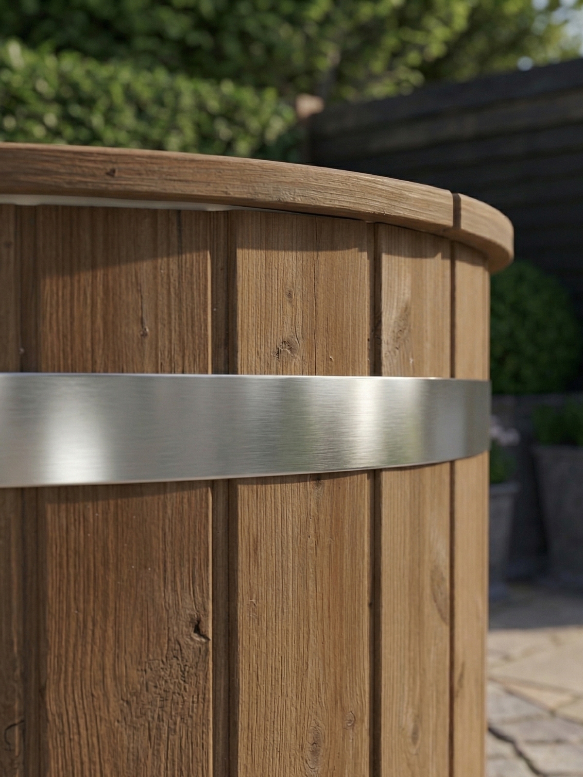 Wooden barrel with a metal band, outdoor setting