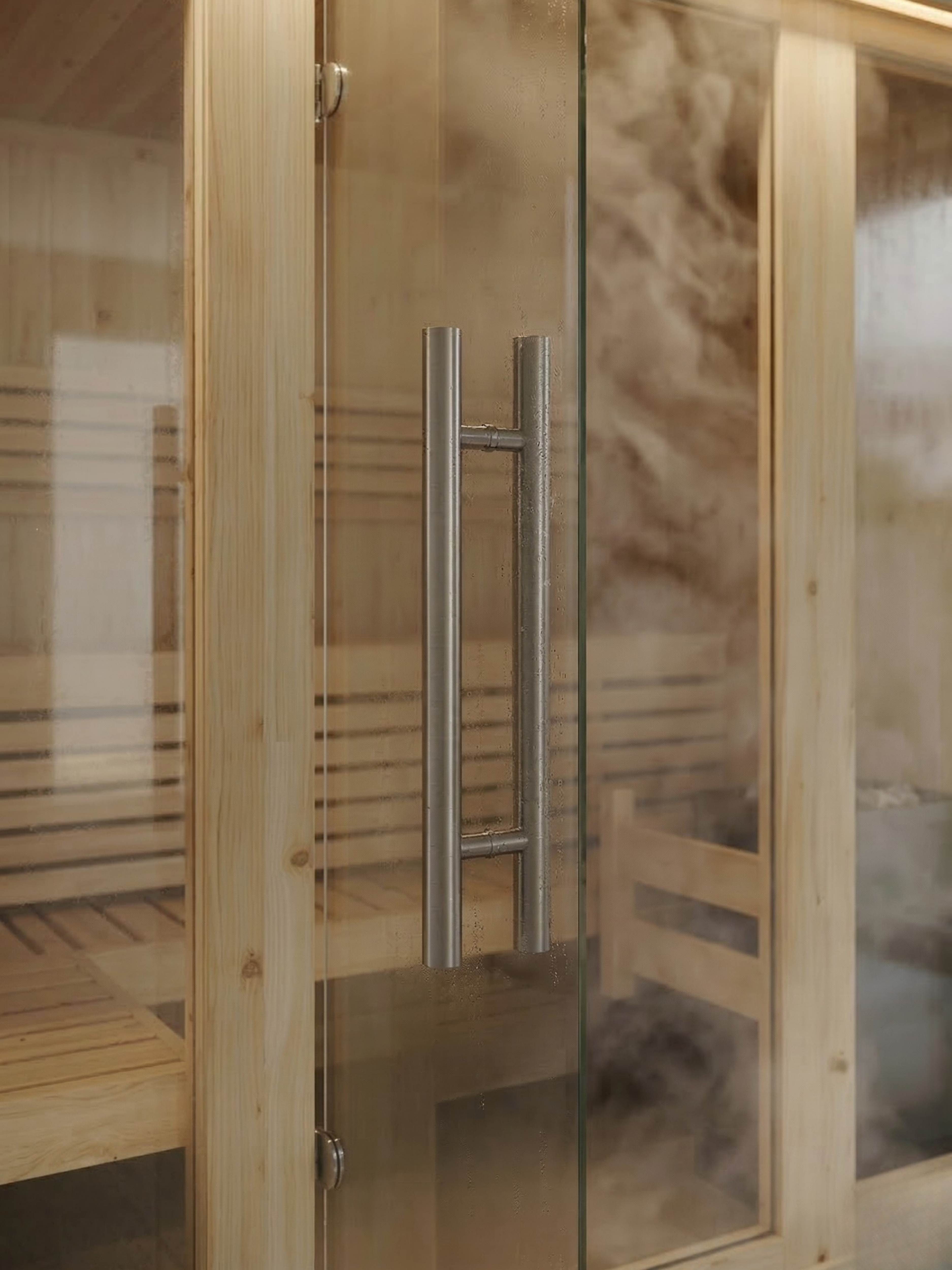 Wooden sauna with glass door and metal handles