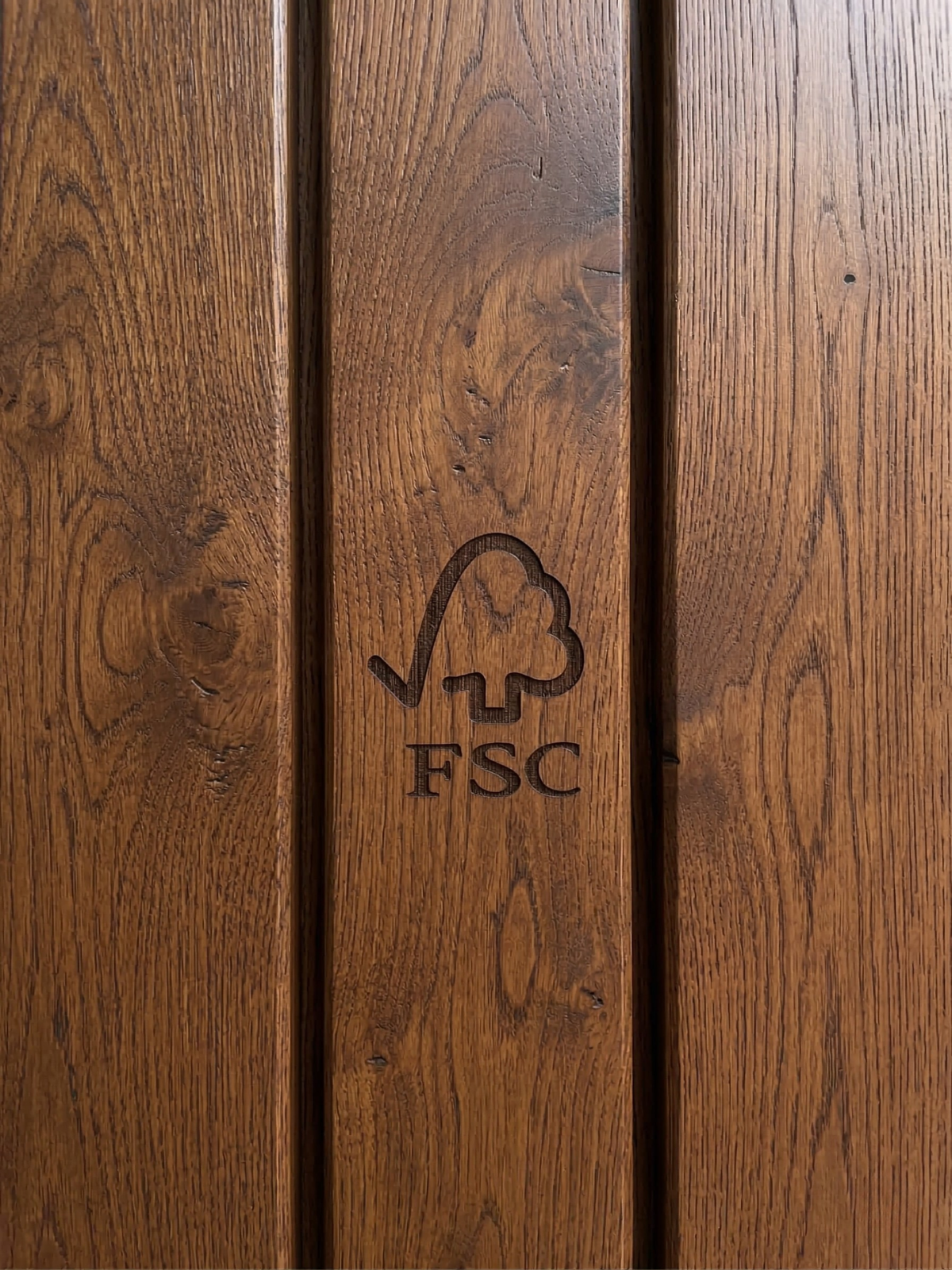 Wooden surface with FSC logo engraved on it