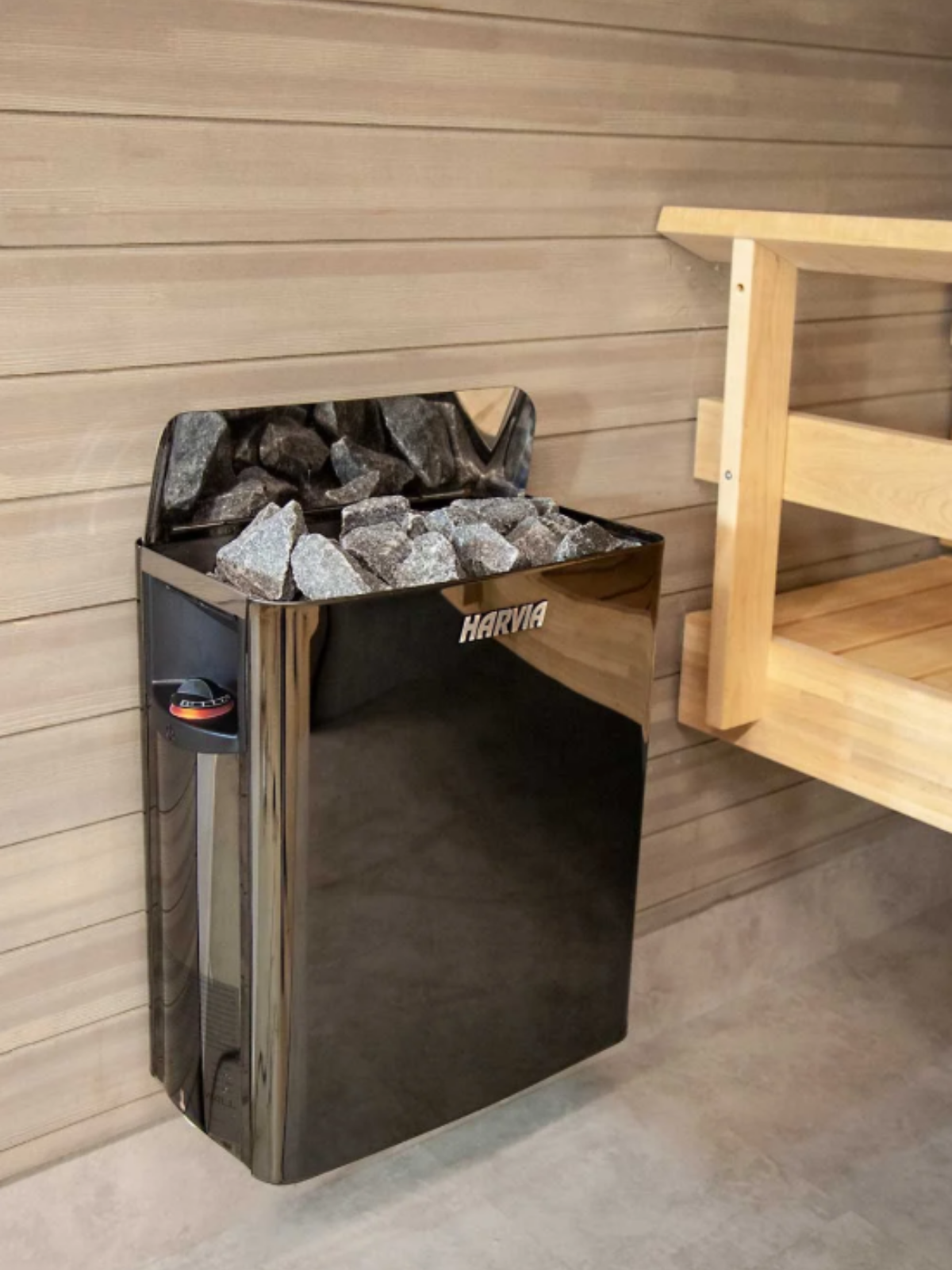 Harvia sauna stone cabinet with wooden bench in a sauna setting