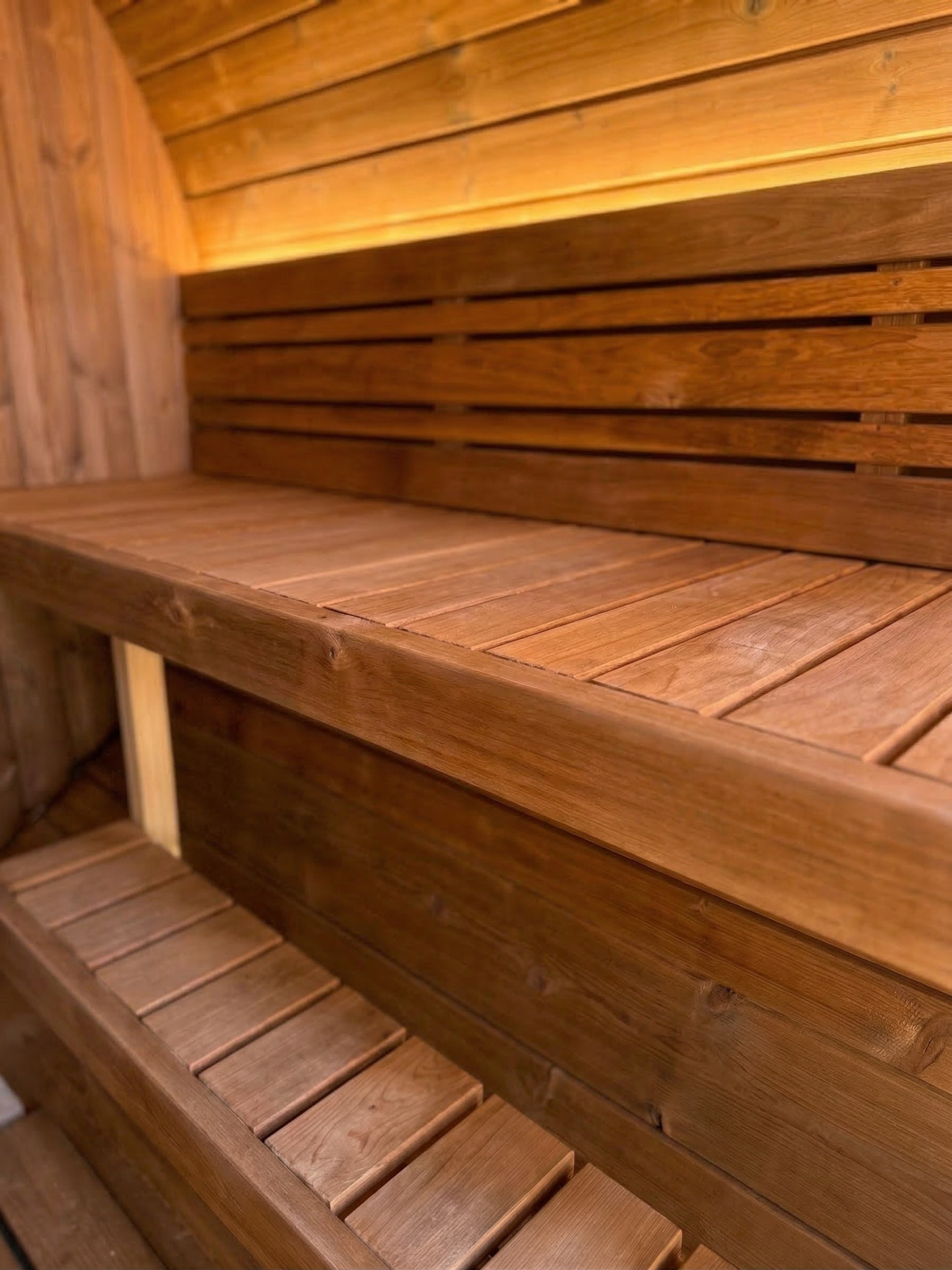 Wooden bench and wall inside a sauna