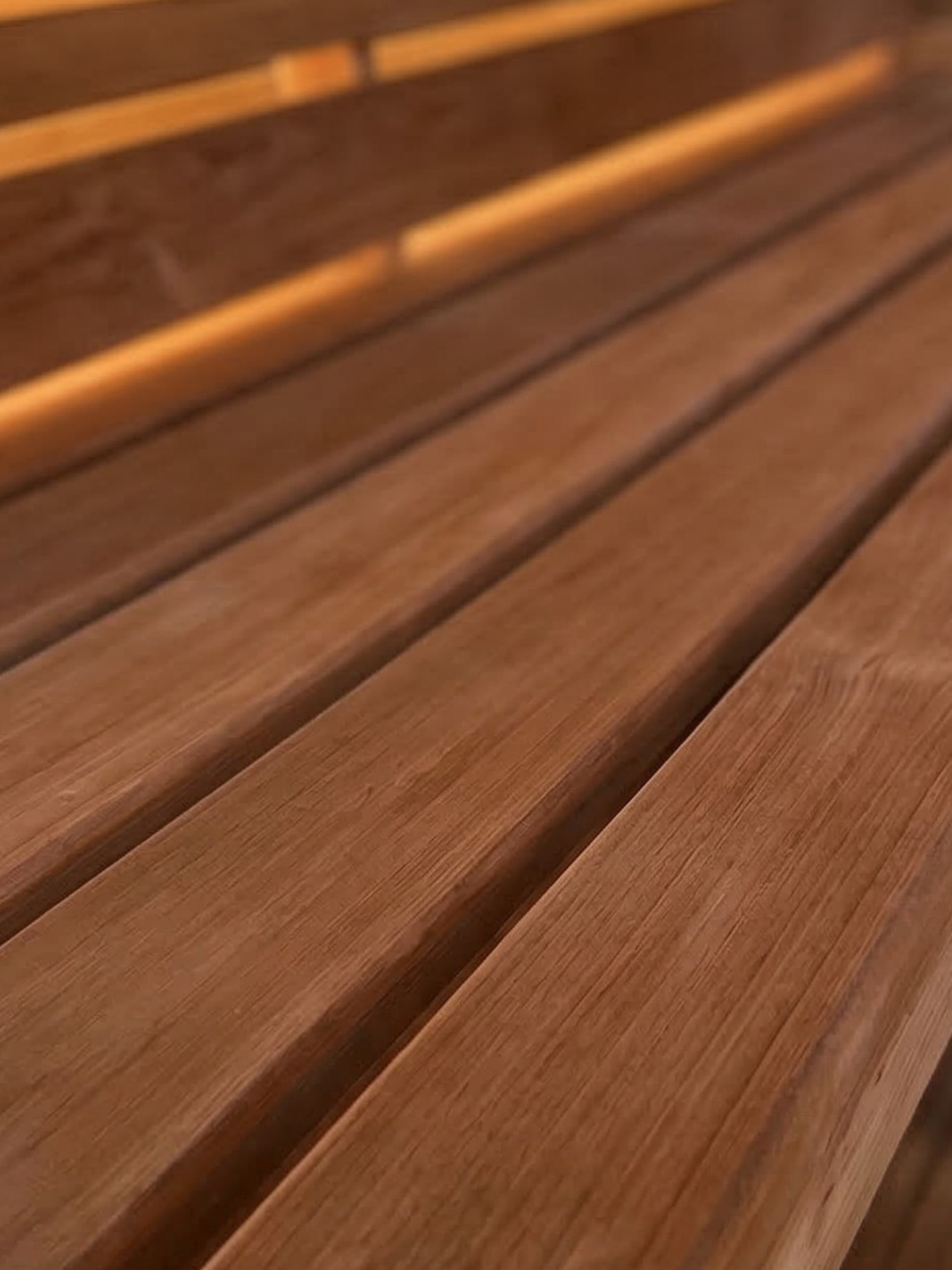 Close-up of a wooden bench with slatted design