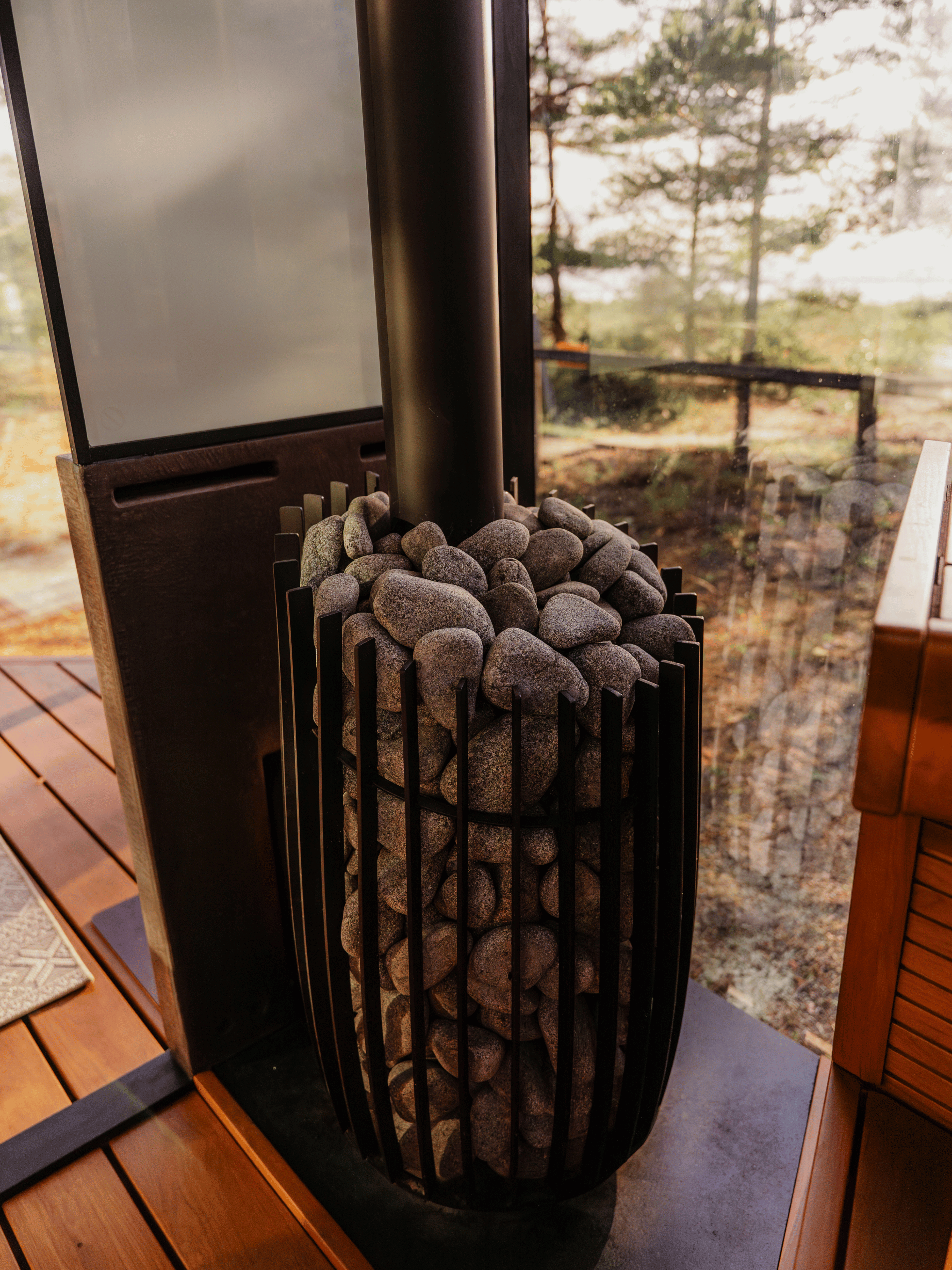Outdoor fireplace with stone design on a wooden deck