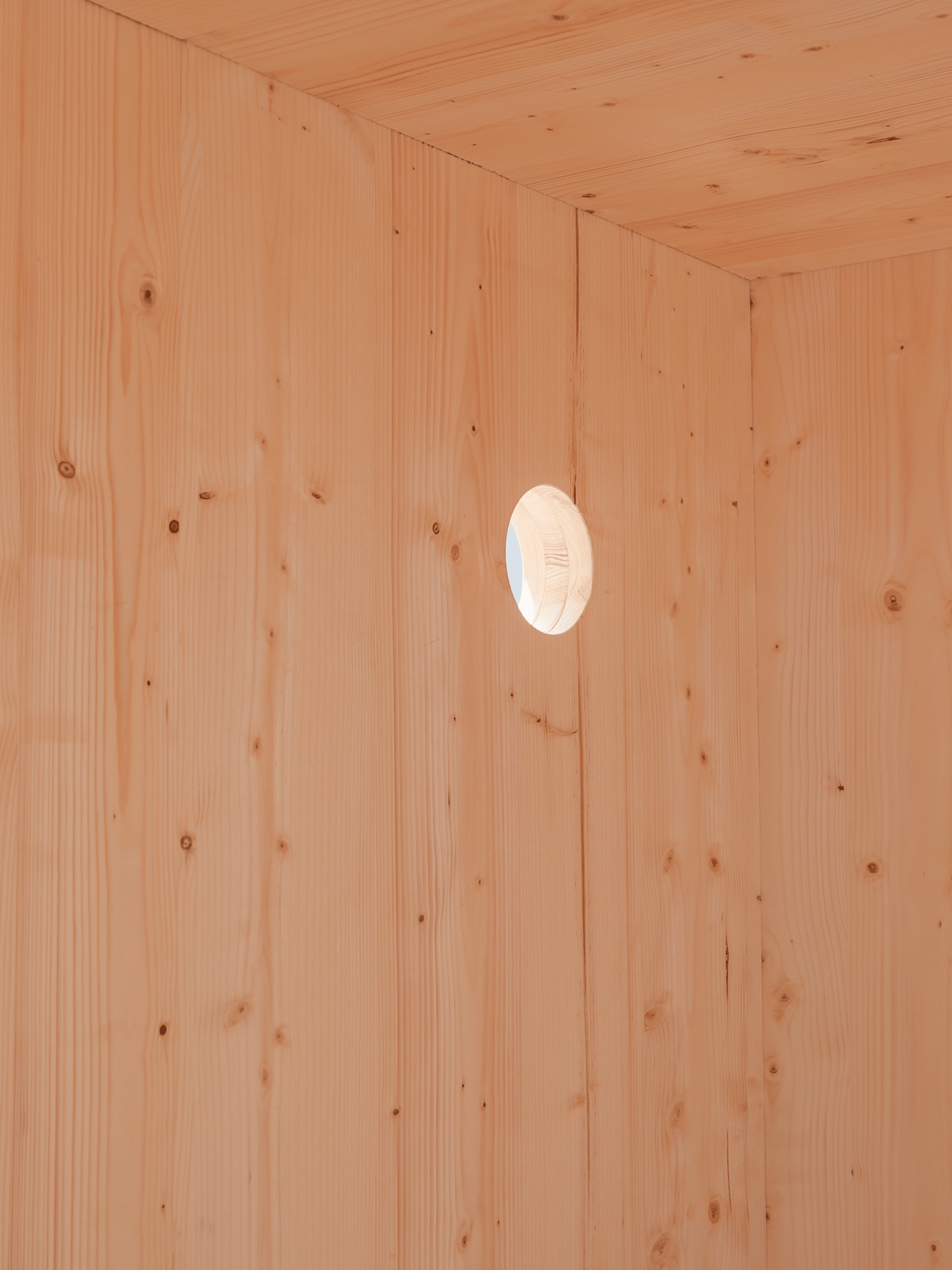 Wooden wall with a circular light fixture