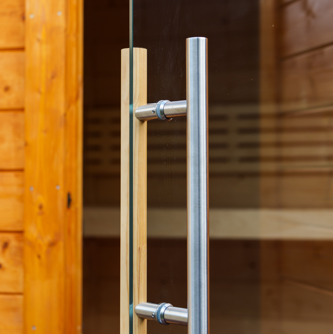 Glass door with metallic handle and wooden frame